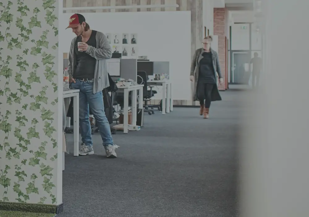 REWE working space with people standing, talking and walking
